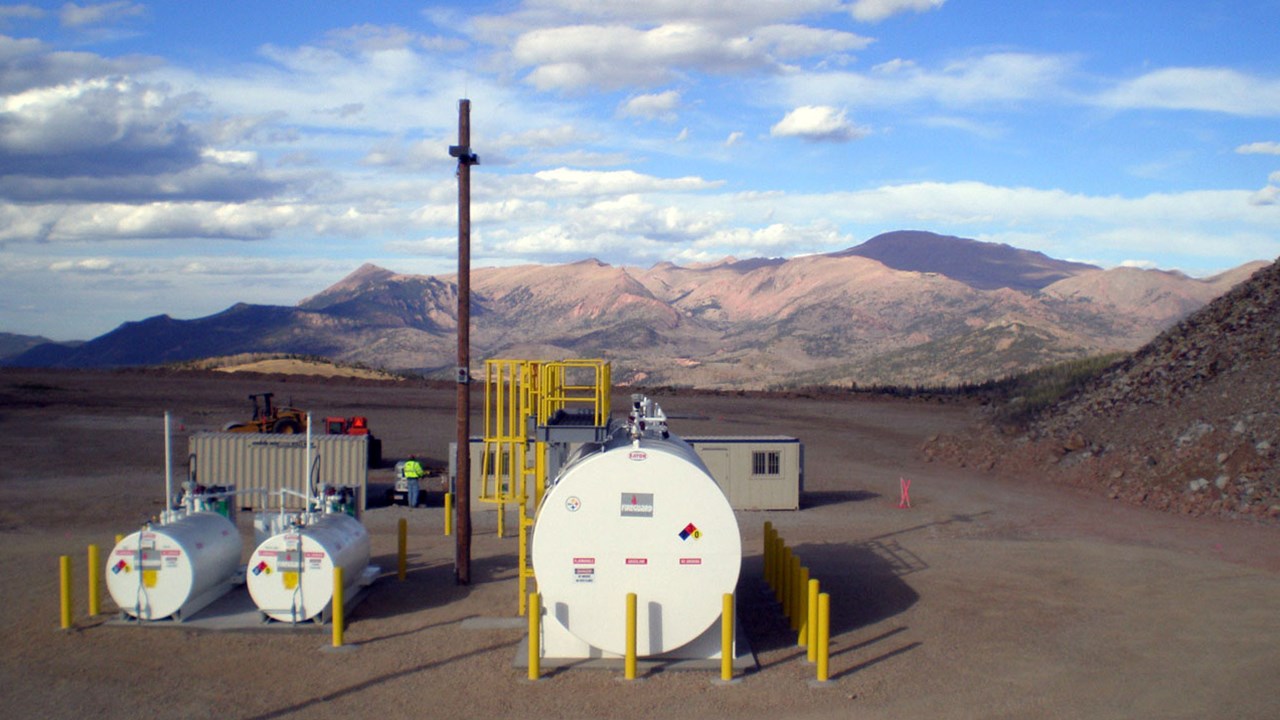 Overlooking a Fireguard tanks fueling site with a scenic view of the mountains.