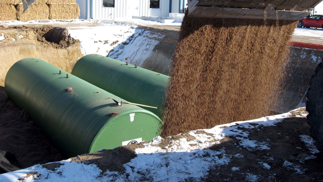 A pair of Titan double-walled storage tanks being buried.